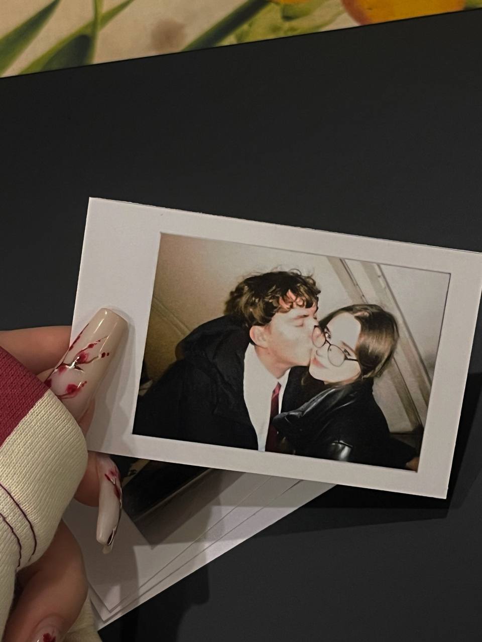 A printed polaroid of us kissing